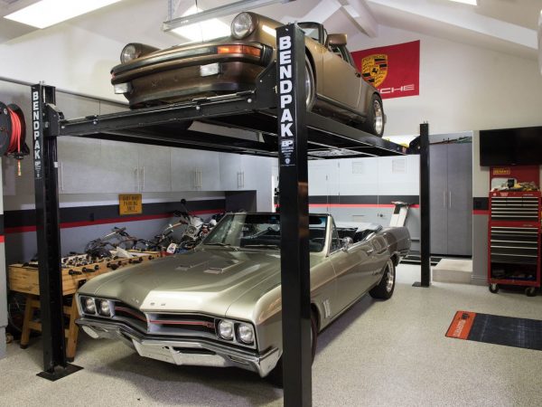 two cars in a garage built by building pros