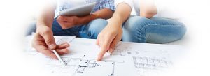 Hands pointing at a home remodeling blueprint