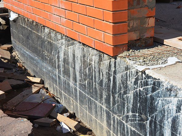Structural defects in foundation of building that need repairs.